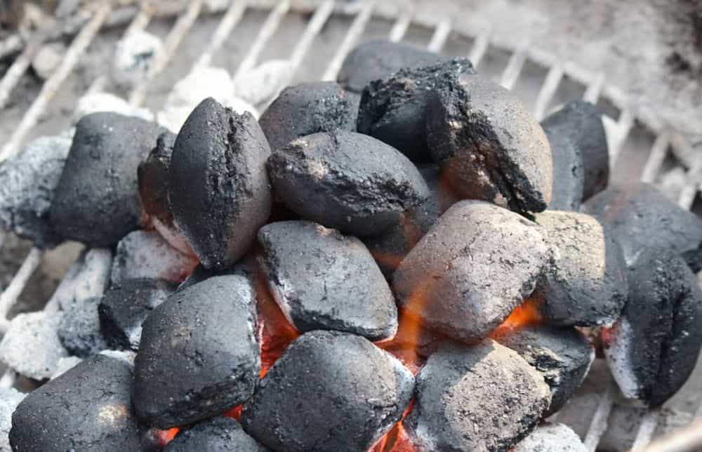 Smart grill thermometer reducing charcoal waste
