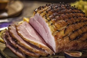 Glazed Holiday Ham with Cloves Served for Dinner