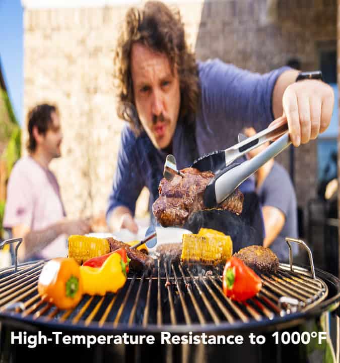 Grill master cooking steak and vegetables with ChefsTemp high-temperature resistant tools outdoors.