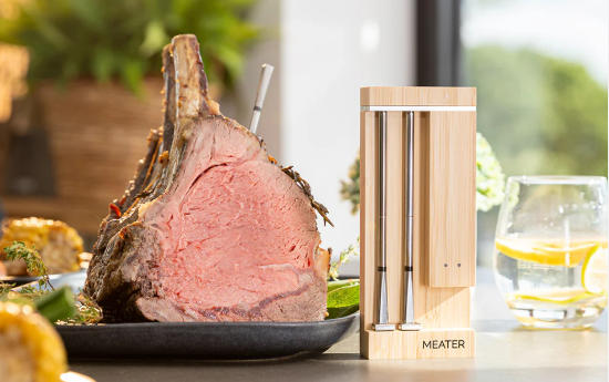 High-quality meat thermometer with wooden stand for precise grilling temperature control.