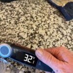 Digital food thermometer showing 32.1°F for meat temperature testing.